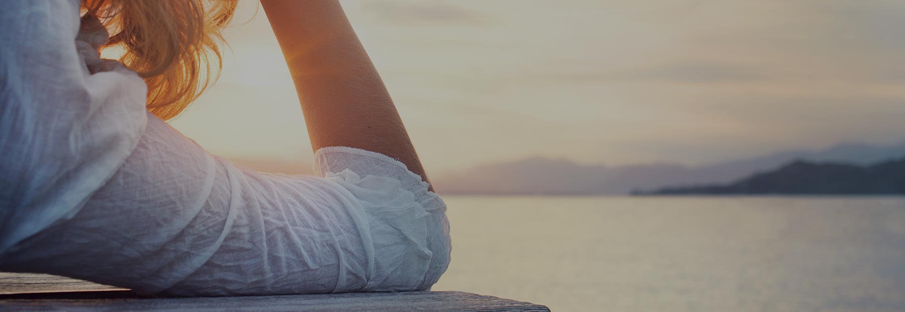 Close up of woman looking out into ocean