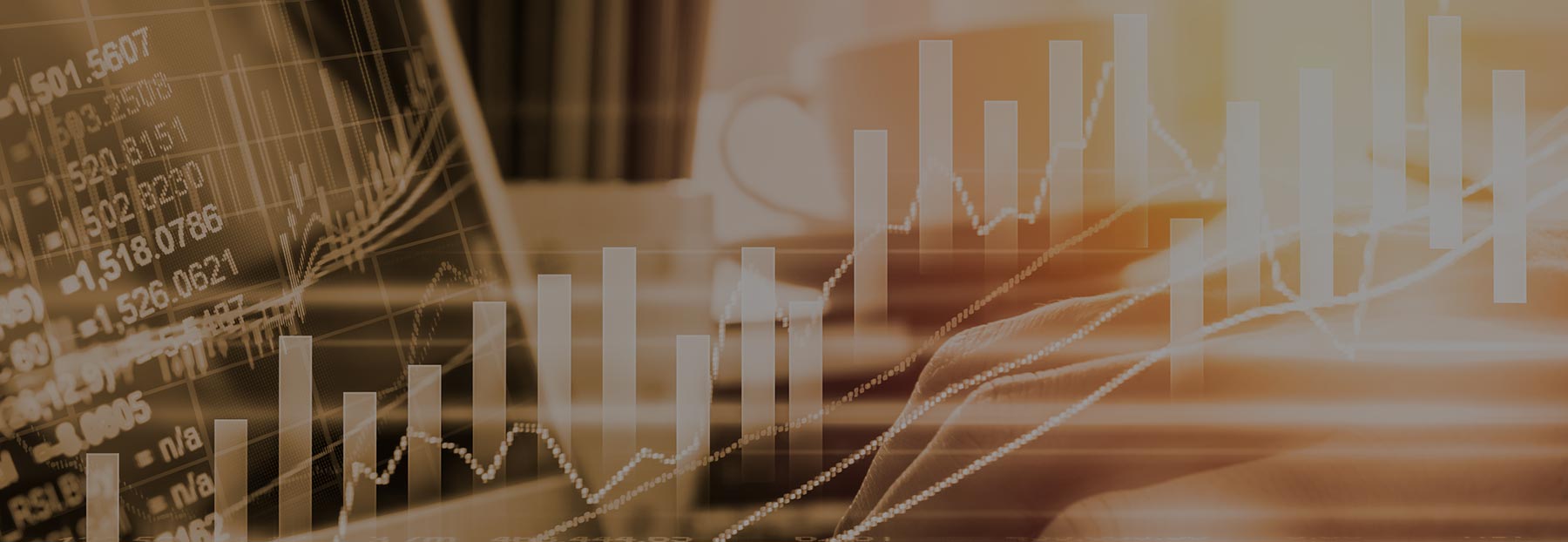 Graphs and stocks overlaying person looking at computer