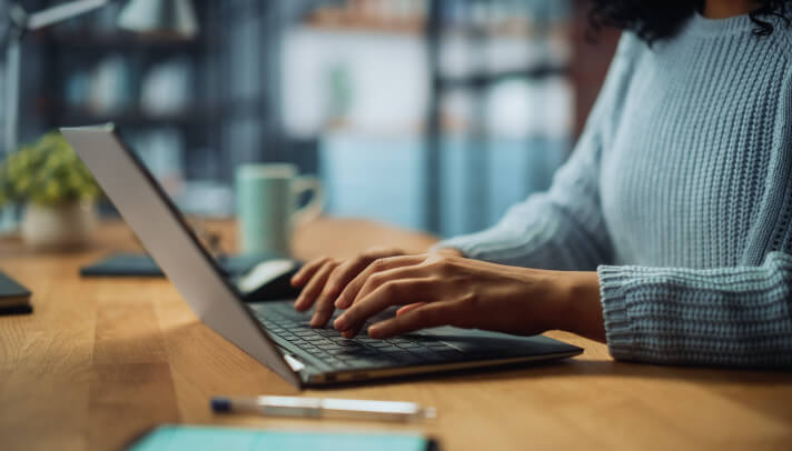 Typing away on a laptop keyboard